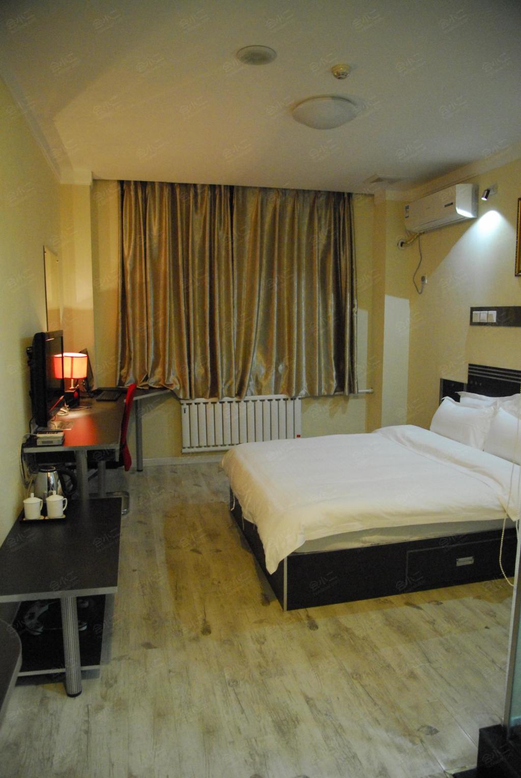 济南红苹果商务酒店客房图片